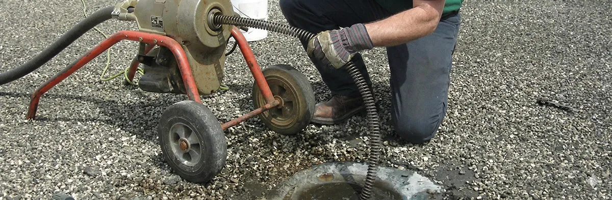 sewer rodding technician actively removing blockages from a sewer line in San Jose, CA